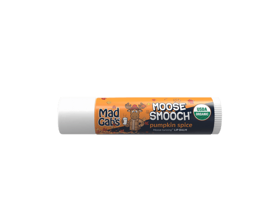 A tube of Moose Smooch pumpkin spice lip balm with a white cap and a label featuring a cartoon moose, on a solid white background.