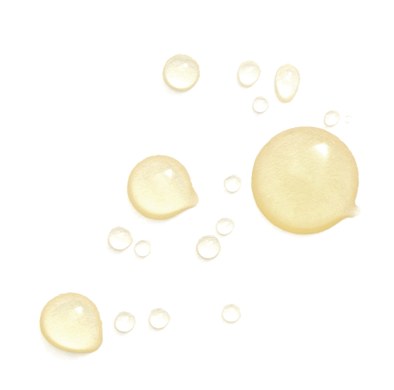 vitamin E oil droplets on a white surface